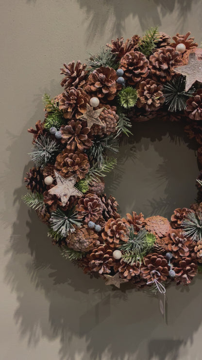 Wreath with pinecones and brown details